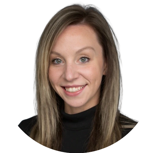 Professional headshot of a smiling woman with straight, highlighted hair wearing a black turtleneck.